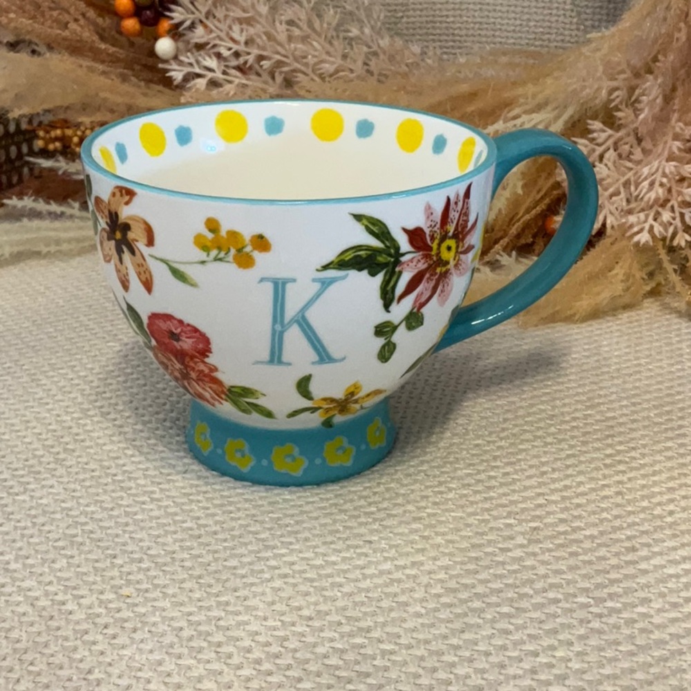 Floral coffee cup with a K initial